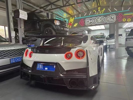 ニッサン GTR カーボンファイバーボディ キット GTR r35 アップグレード 2024ニスモスタイル フロントとリア バンパースポイラー フードフェンダー