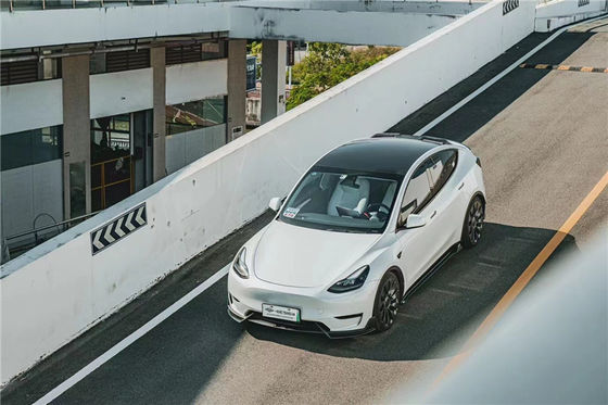 テスラ用のオートパーツ MODEL Y カーボンファイバーボディキット MODEL Y MIW様式のアップグレードされたカーボンファイバー フロントショベルディフューザー スポイラーボディキット